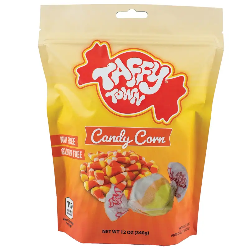 A 12 ounce Taffy Town Candy Corn pouch, printed with candy corn and two pieces of wrapped orange and yellow taffy